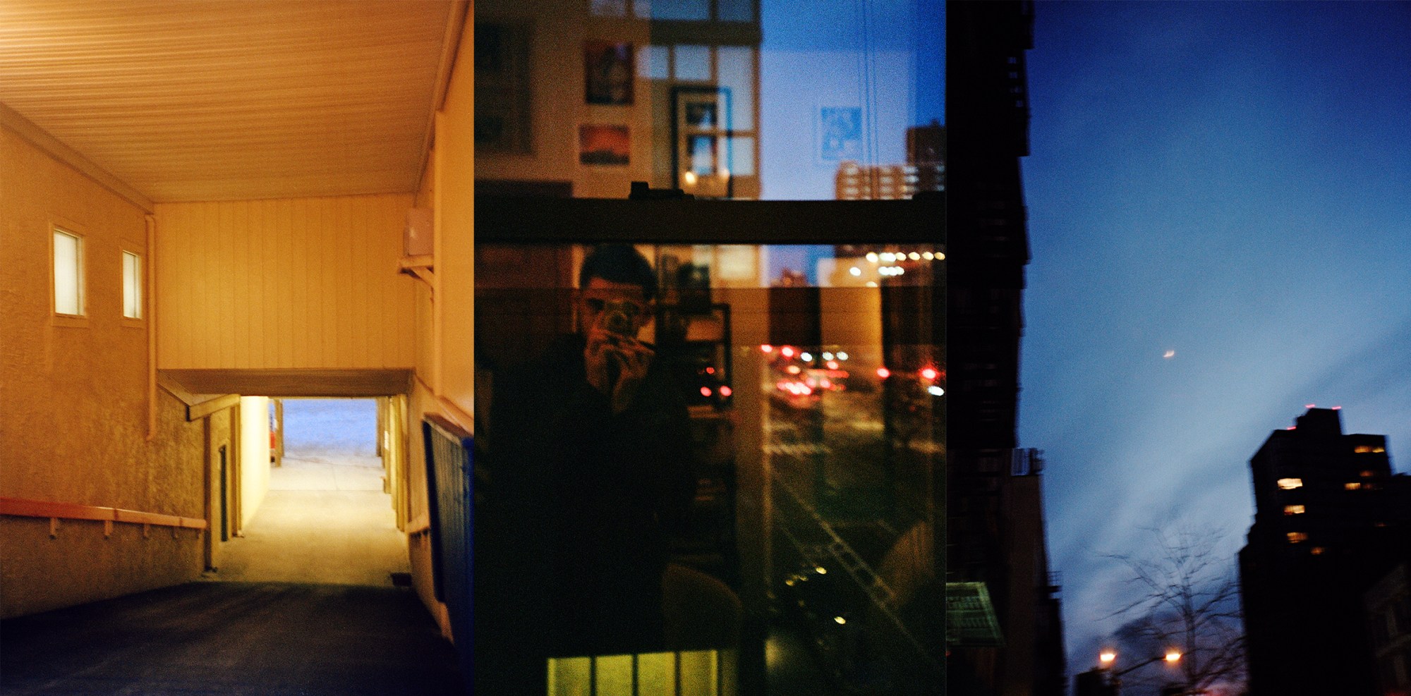 a man takes a photo in a window's reflection