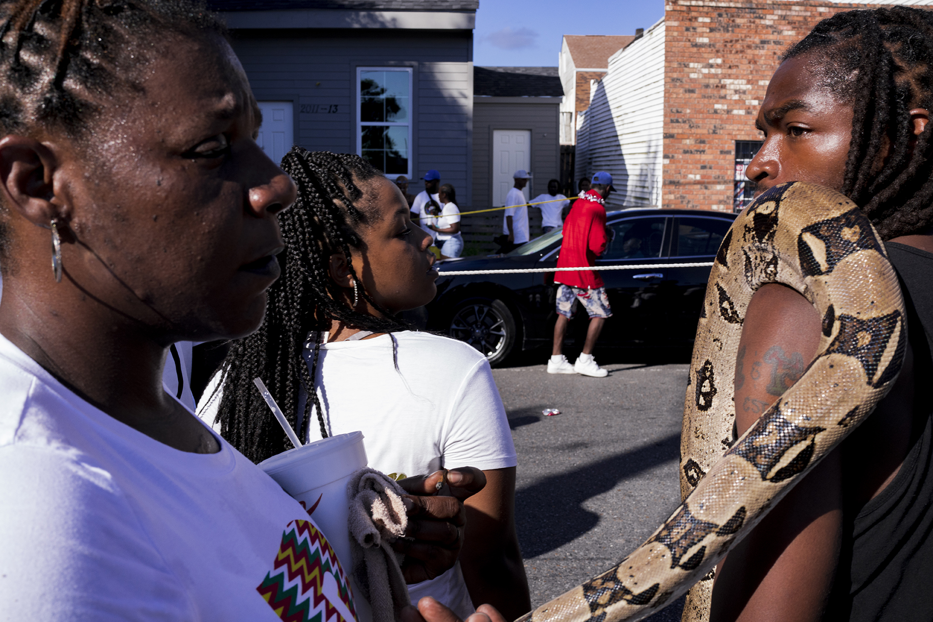 a man holding a large snake in Robert LeBlanc A New America