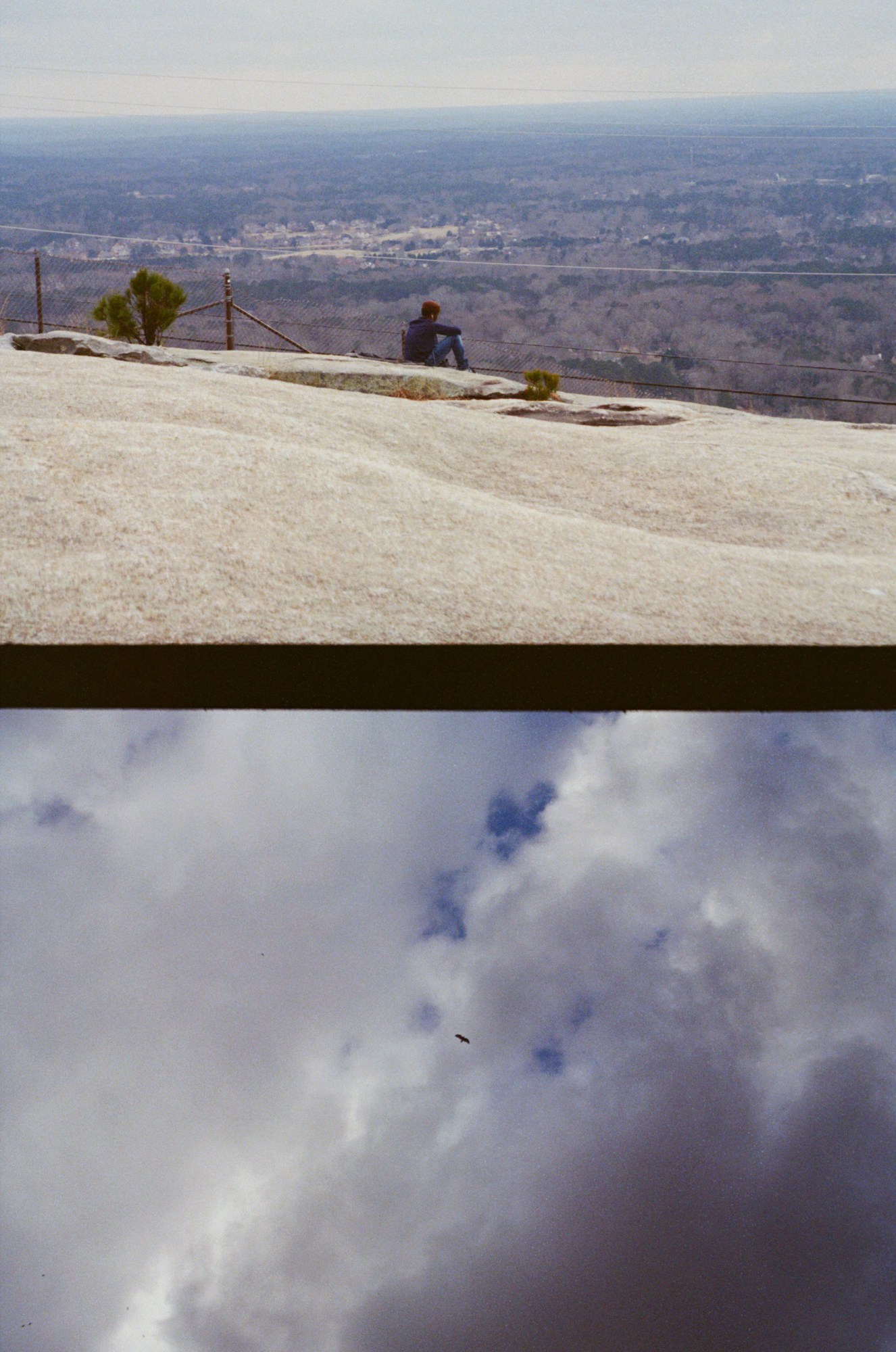 a man looking out over a valley