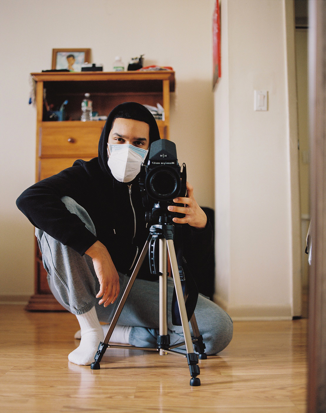 a man with a camera taking a self-portrait