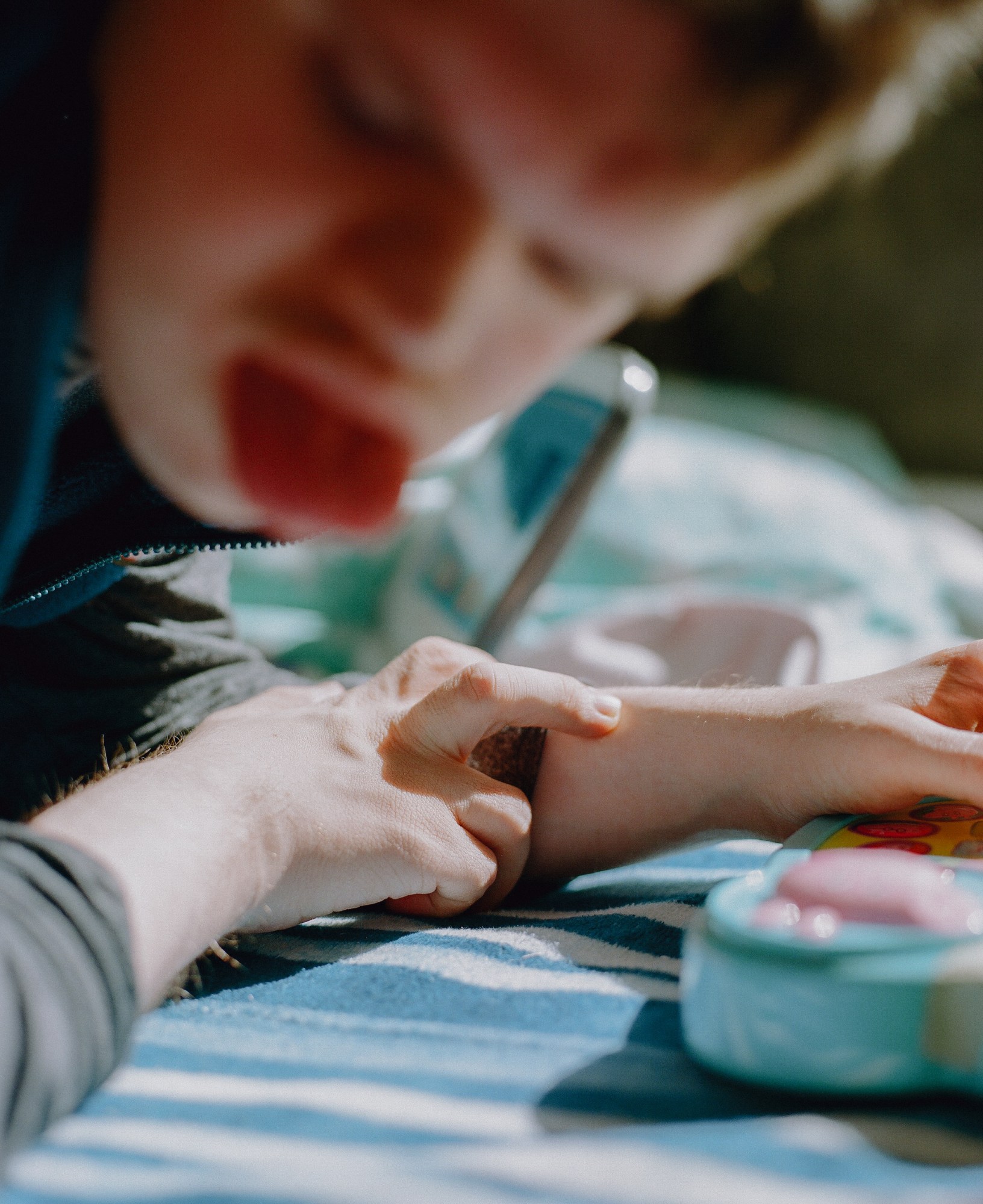 a boy with down syndrome plays with toys