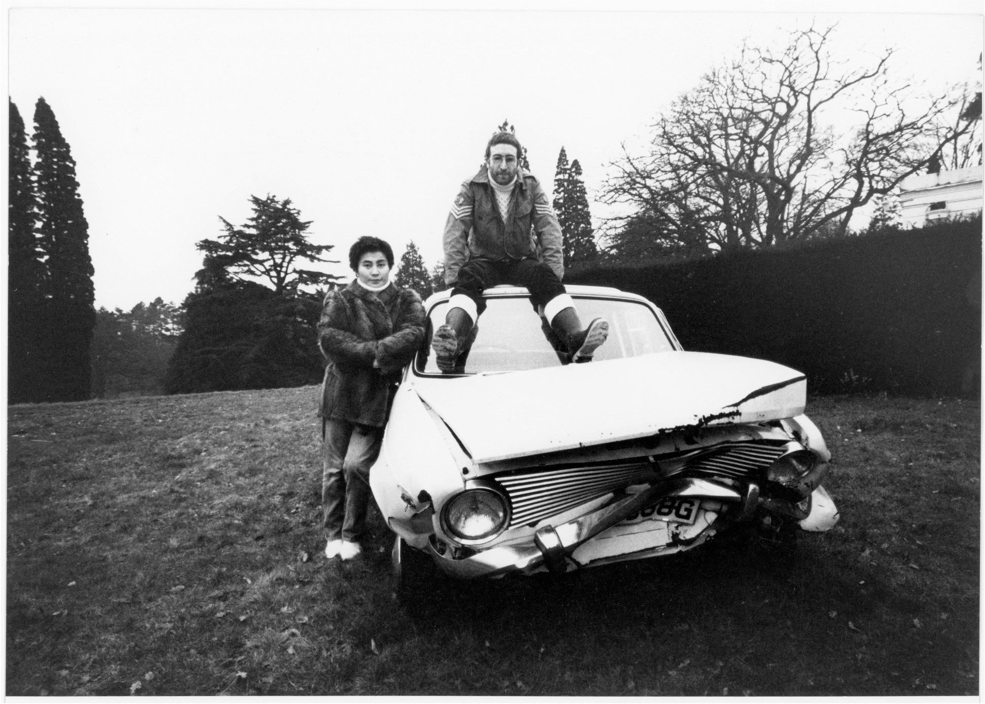 Yoko Ono and John Lennon with their crashed car