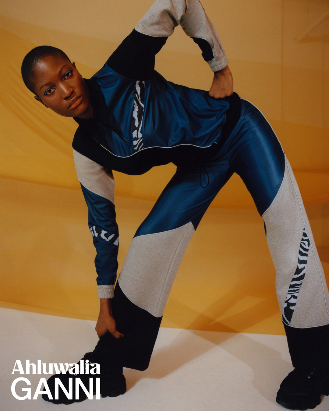 A model wearing a panelled tracksuit look from the Ahluwalia x Ganni collaboration collection