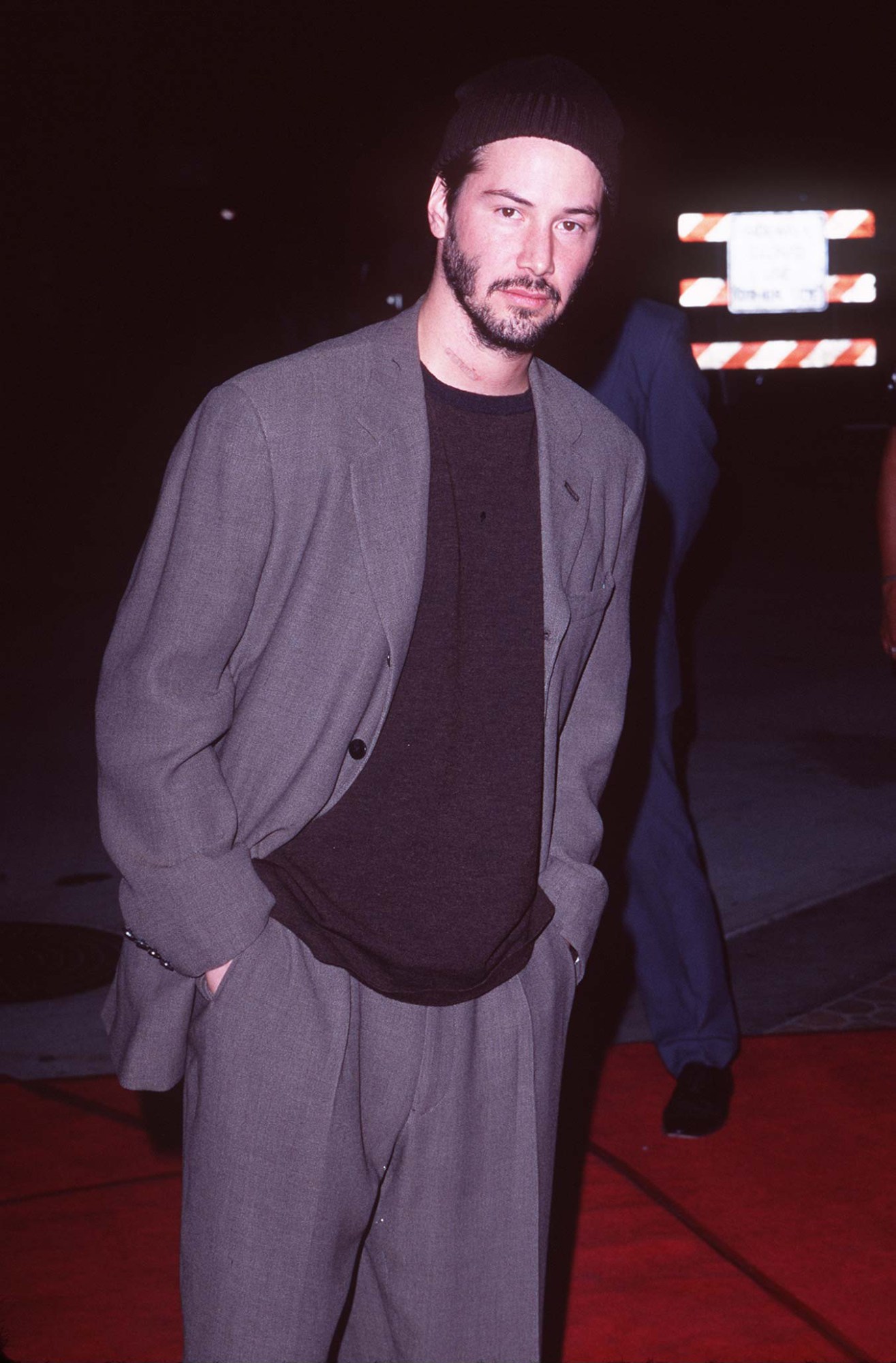 keanu reeves in a beanie on the red carpet at the Devil's Advocate premiere