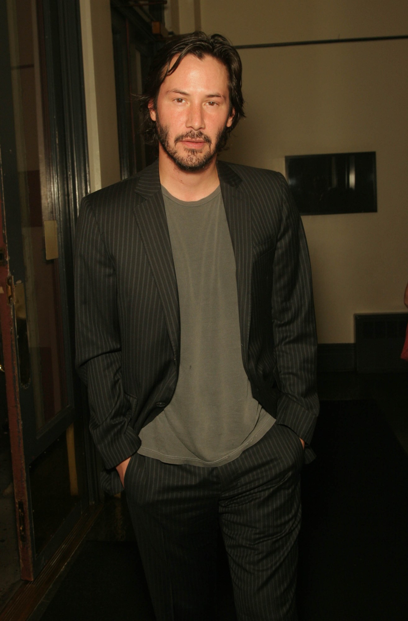 keanu reeves with his hands in his pockets at Amanda De Cadenet's party