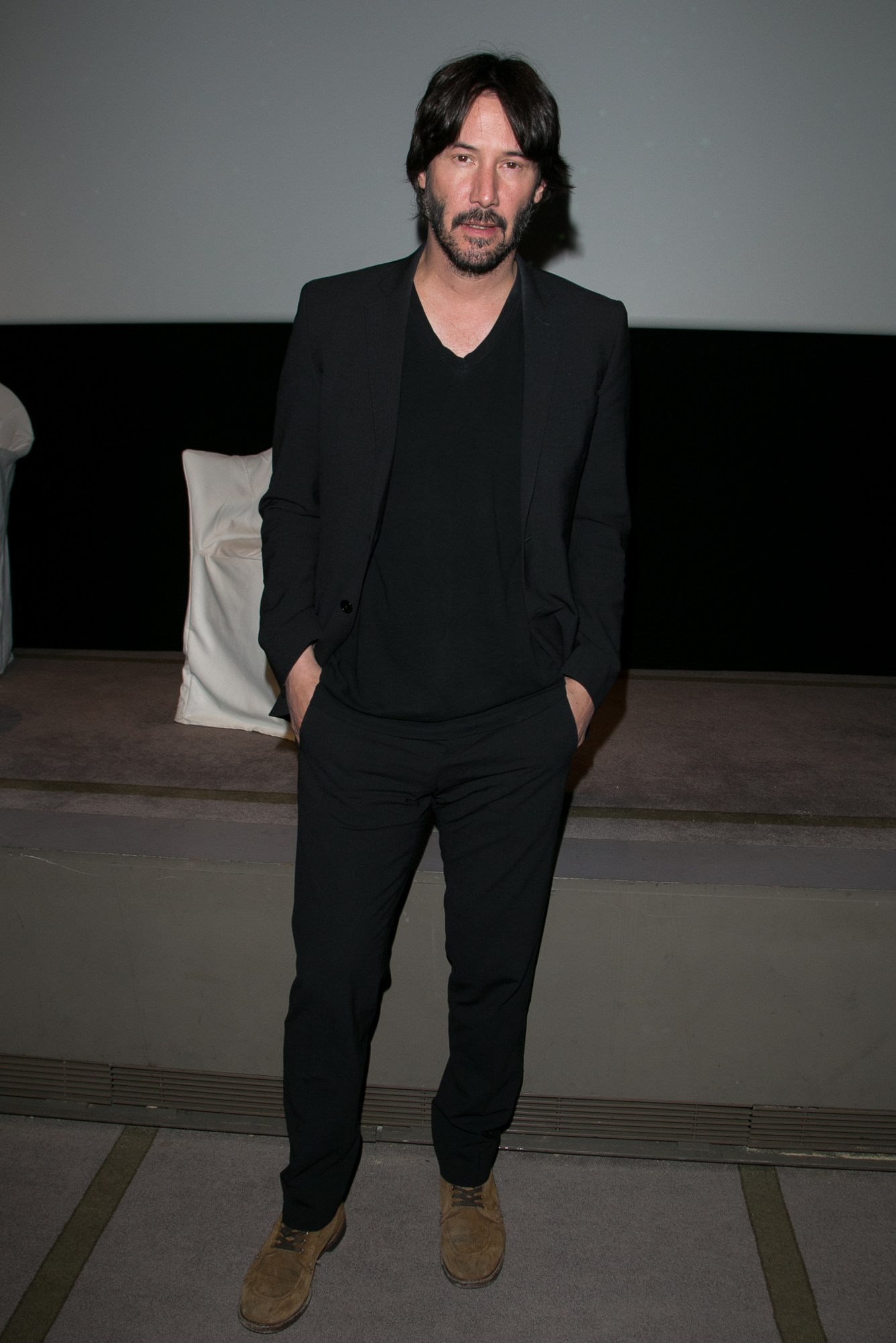 keanu reeves at a film screening in paris in an all-black outfit