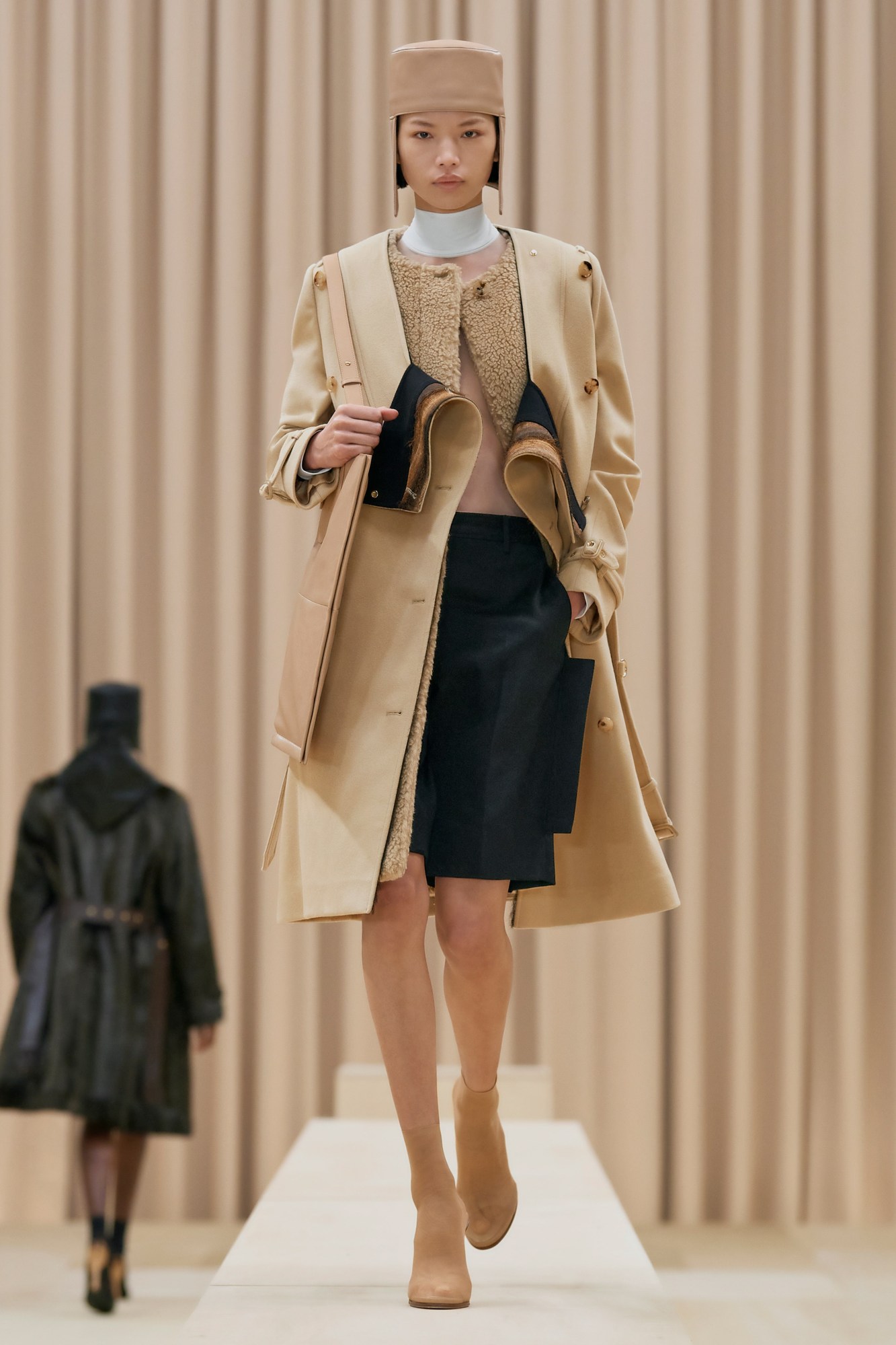 A model walking the runway in Burberry's AW21 womenswear show