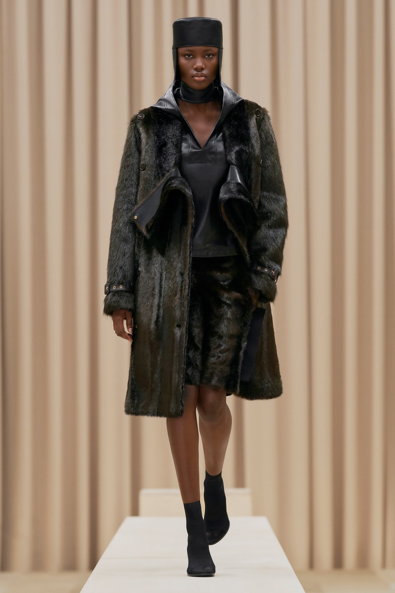 A model walking the runway in Burberry's AW21 womenswear show