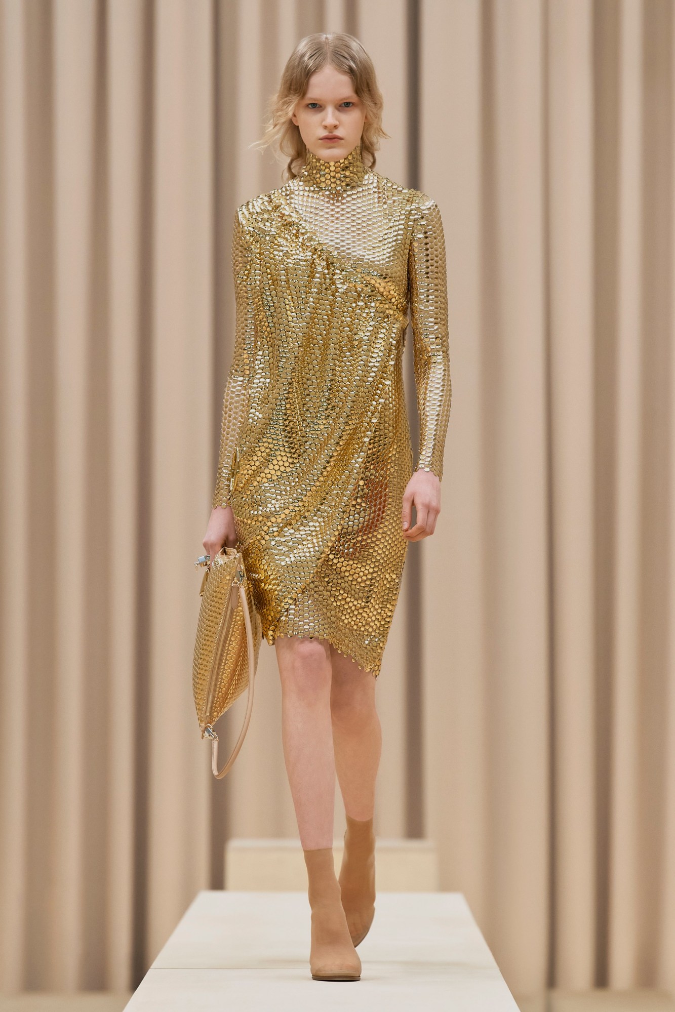 A model walking the runway in Burberry's AW21 womenswear show