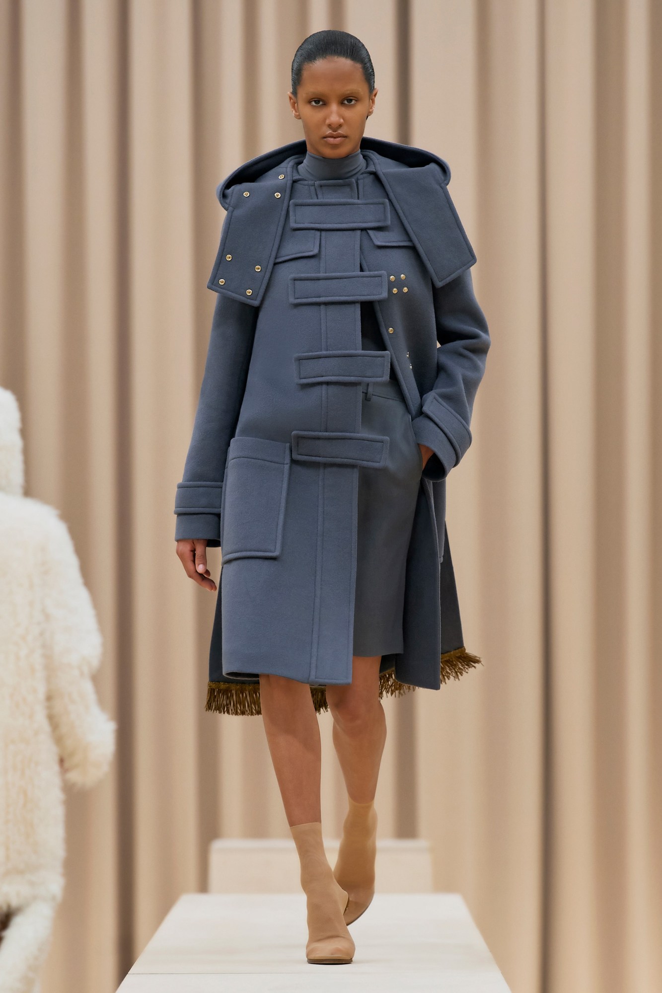 A model walking the runway in Burberry's AW21 womenswear show