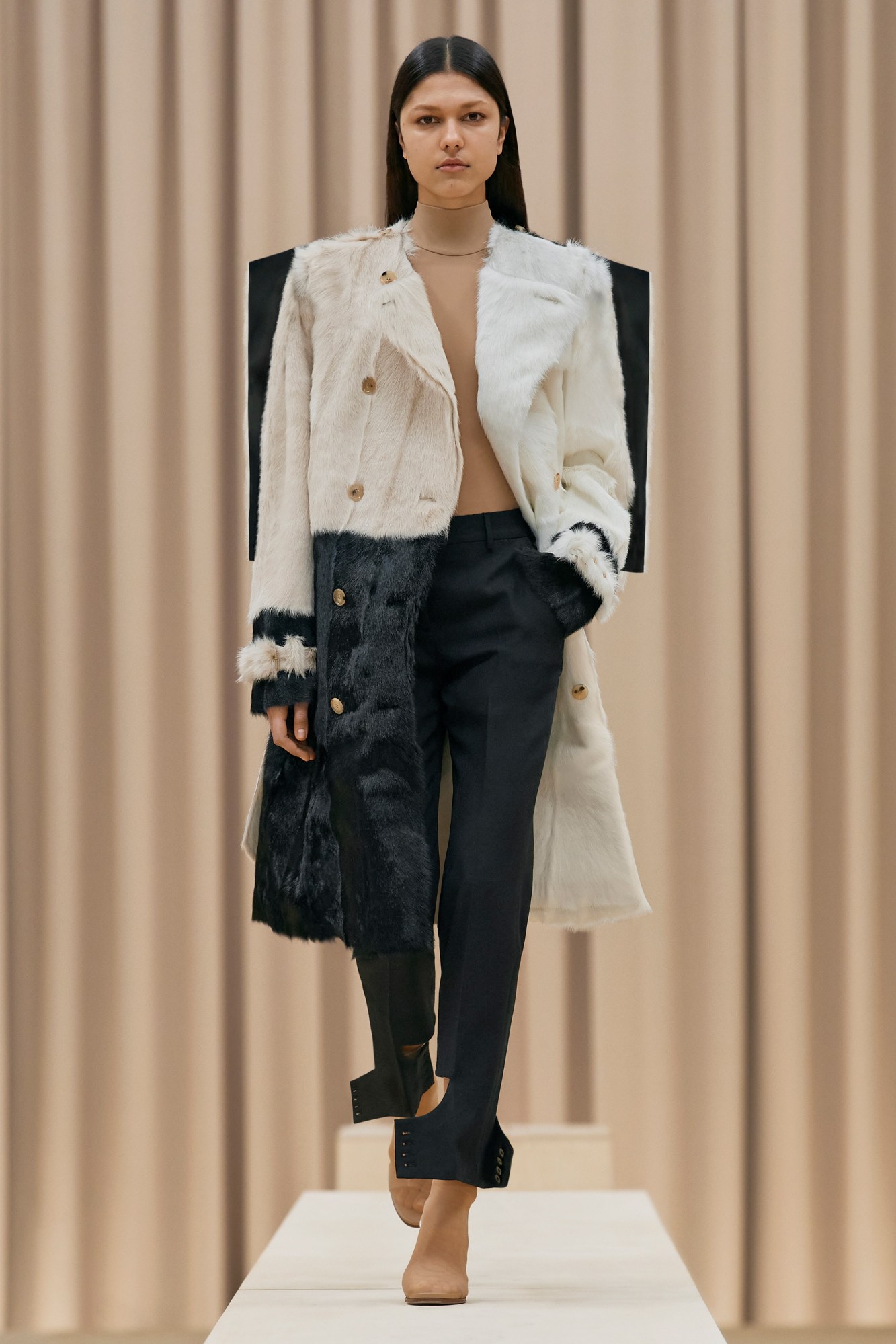 A model walking the runway in Burberry's AW21 womenswear show