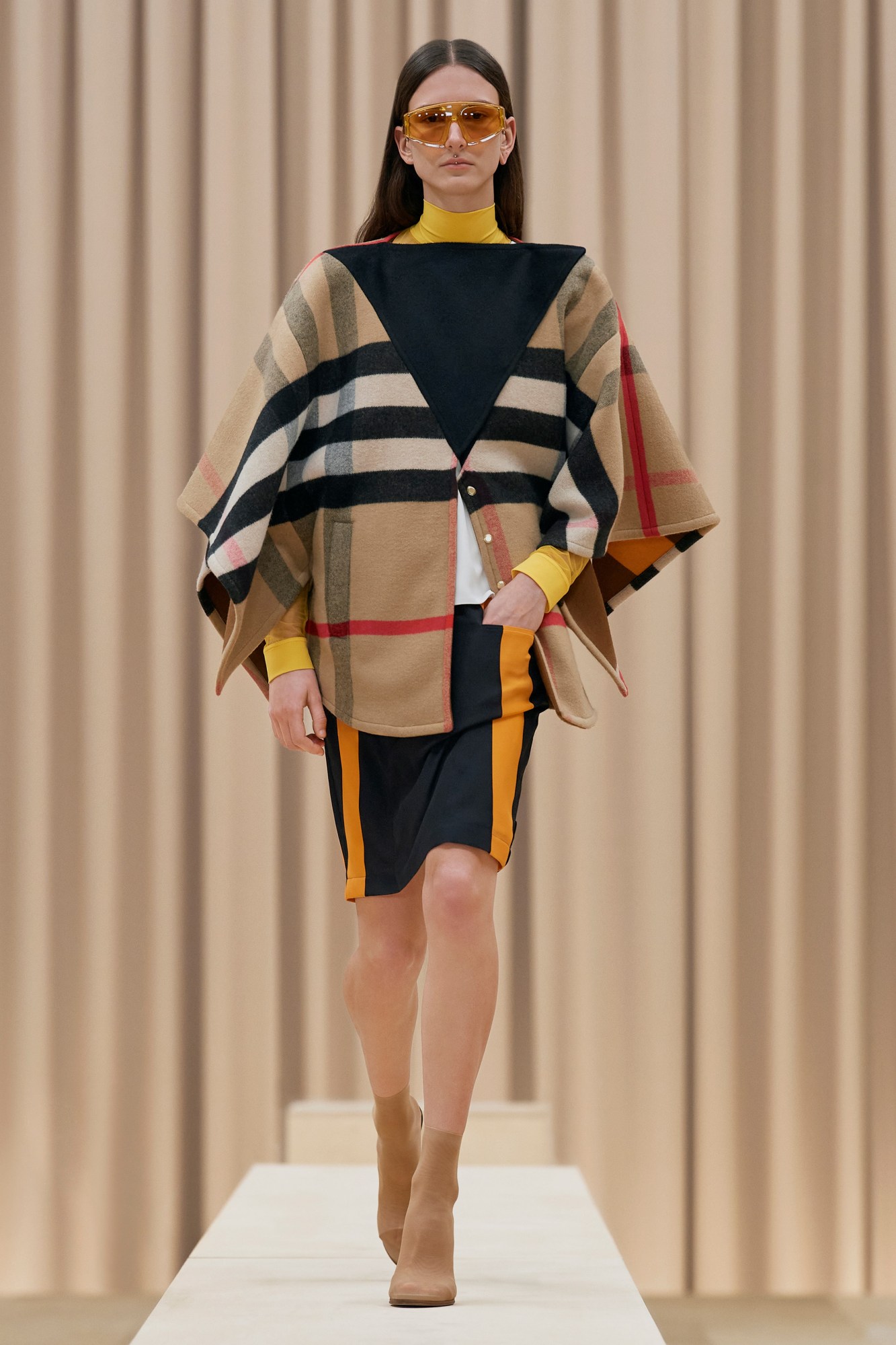 A model walking the runway in Burberry's AW21 womenswear show