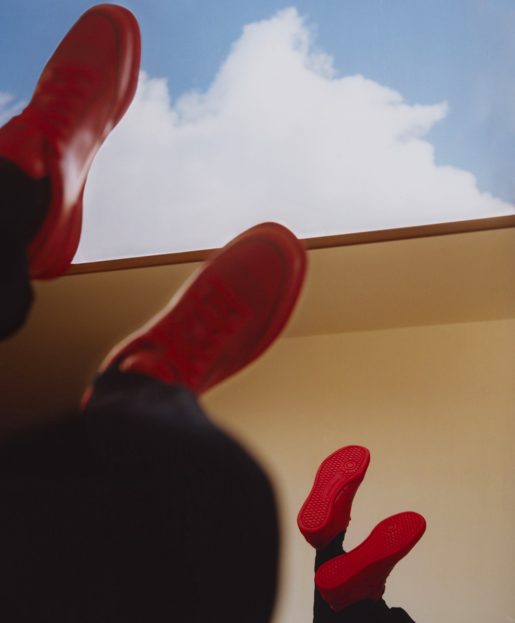 red shoes against a cloudy blue sky