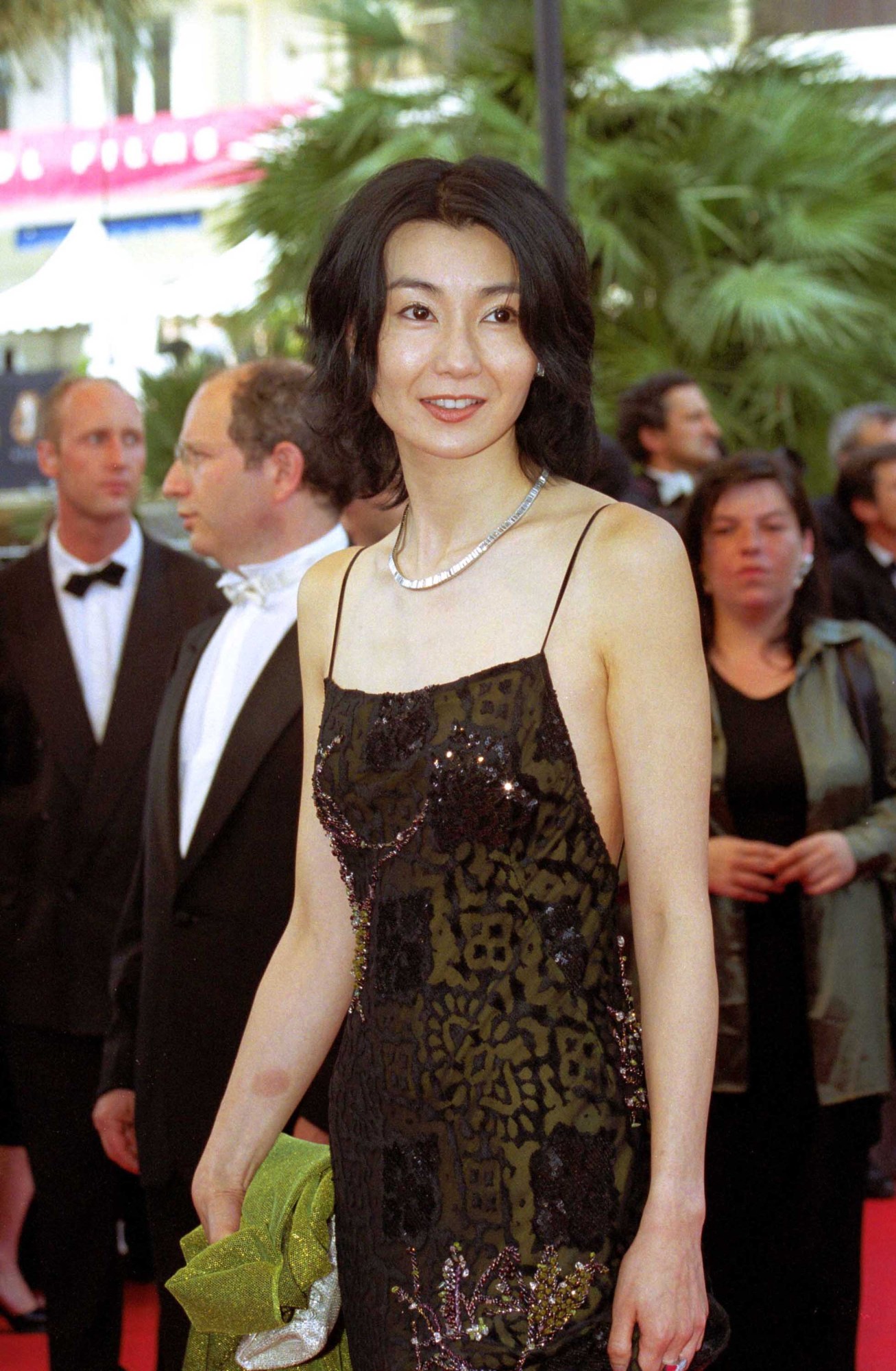 maggie cheung smiling on the red carpet at cannes film festival