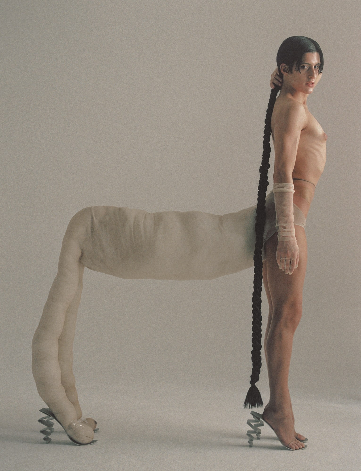 arca with a long hair braid and an animal's body photographed by carlota guerrero