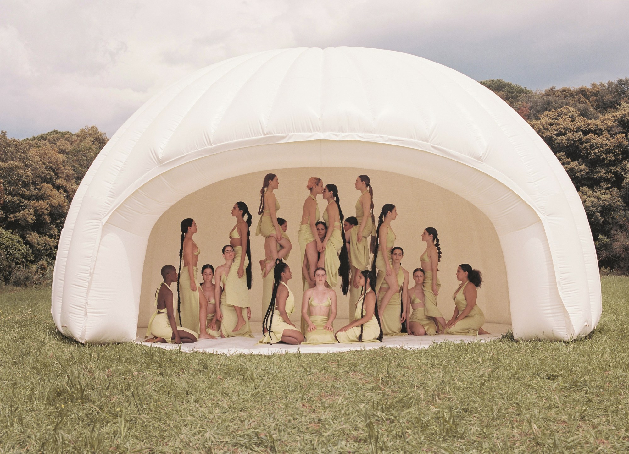 a group of women wearing green outside in a bubble photographed by carlota guerrero