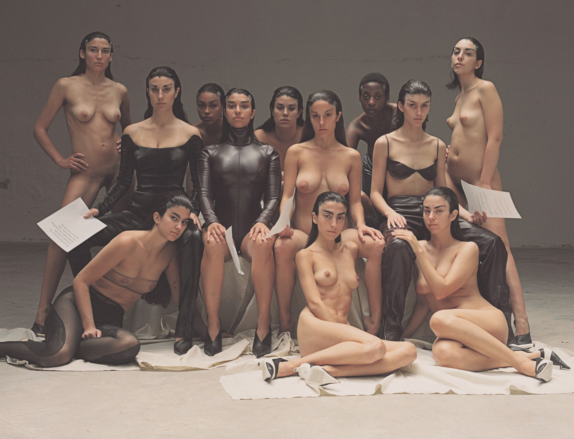 a group of women sitting and looking at the camera half clothed by carlota guerrero