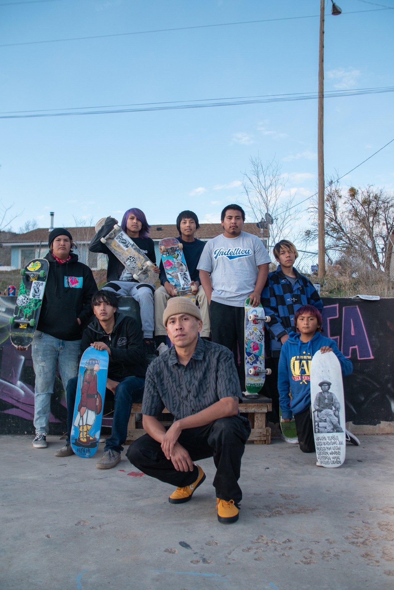 doug miles jr and a group of young skaters at whiteriver reservation