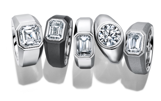 five silver tiffany & co diamond rings in a line