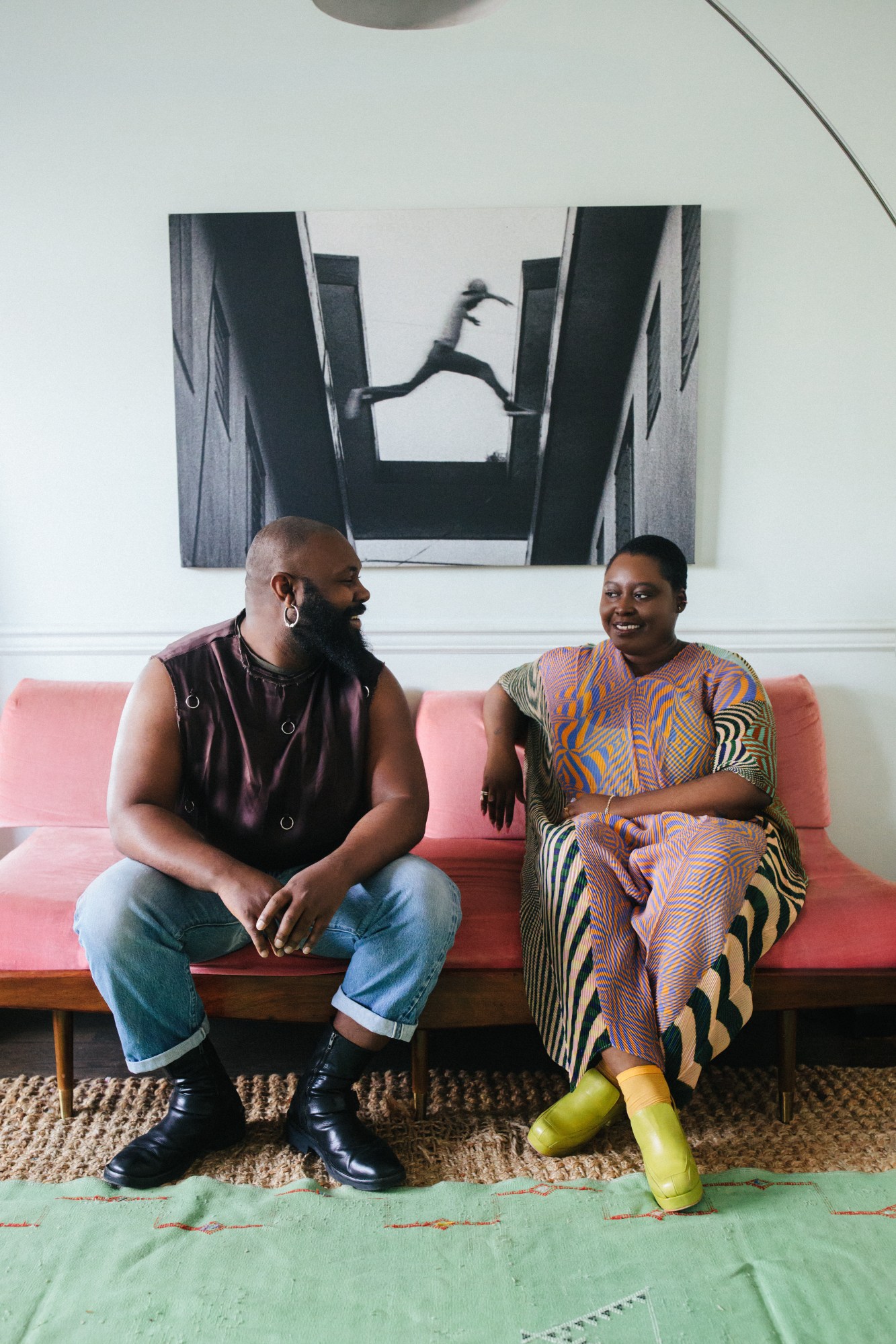 Zeba Blay and Keesean Moore sitting on a pink couch