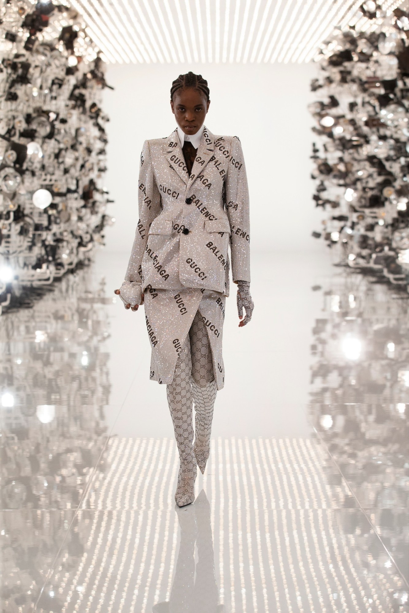 A model walking the runway of Gucci's Aria show wearing a Gucci x Balenciaga collaboration look