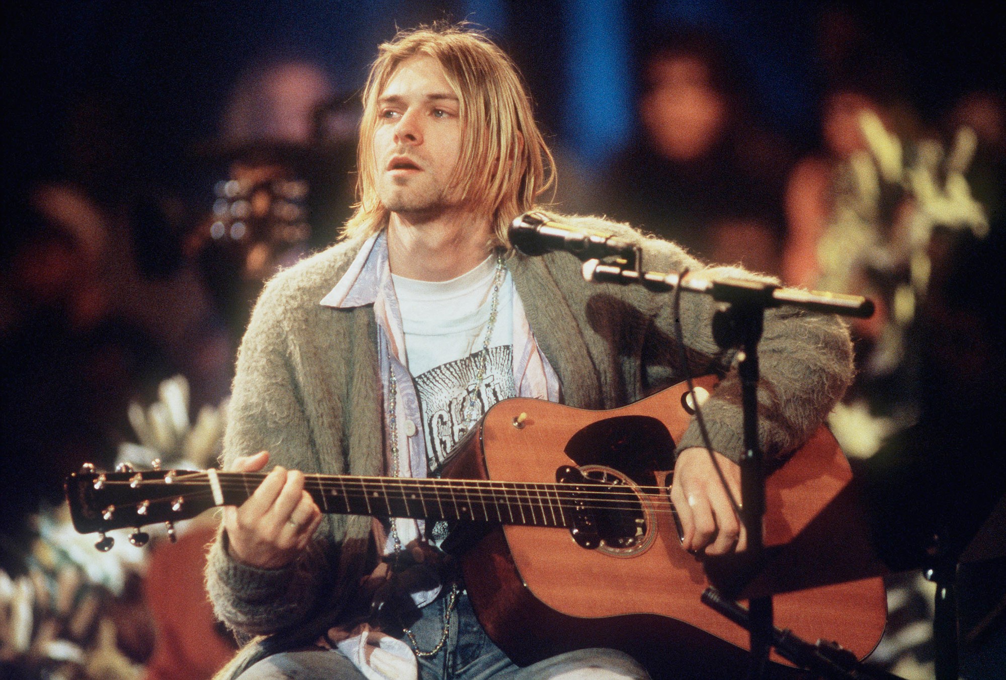 Kurt Cobain playing his guitar at the 1993 MTV Unplugged Nirvana show