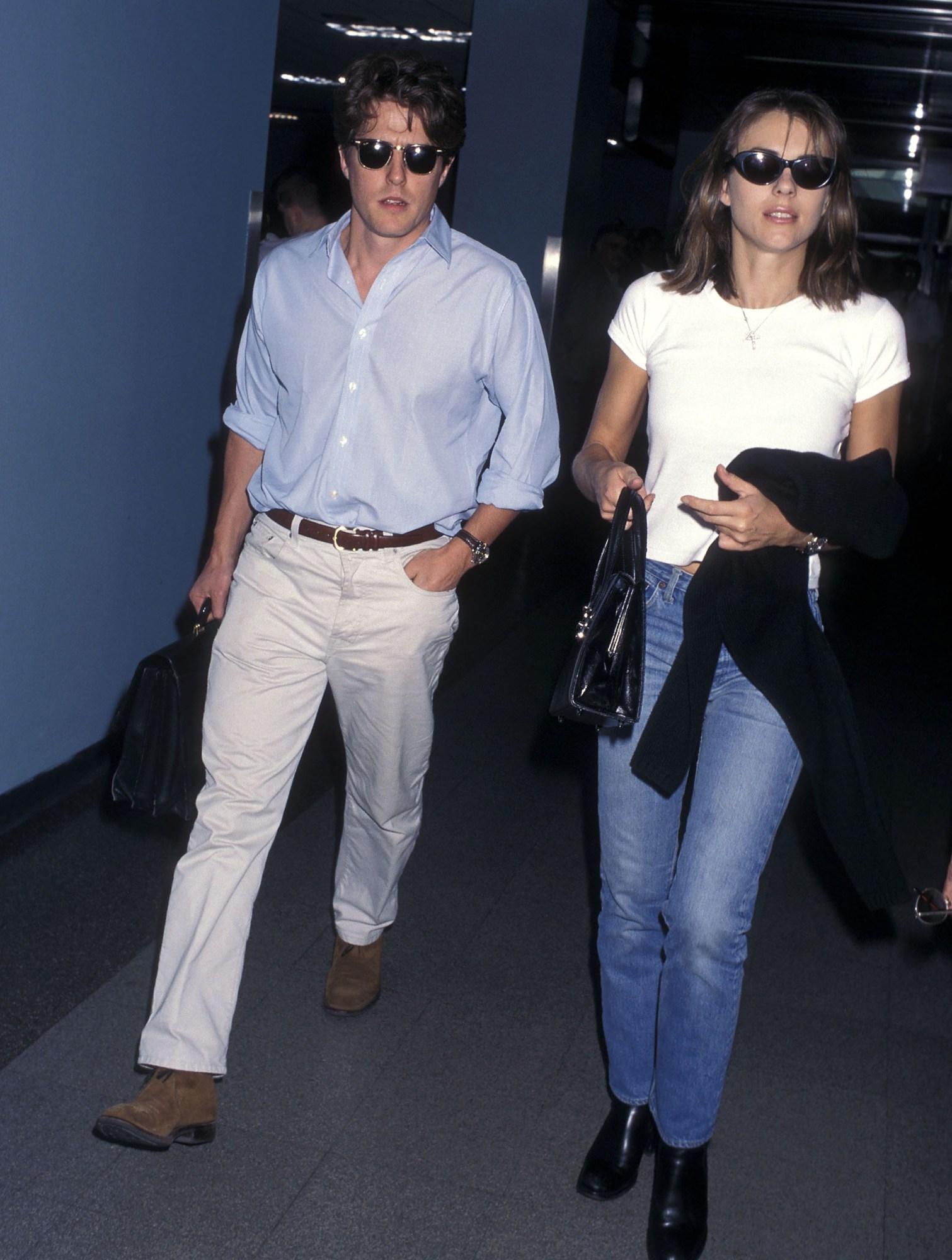 hugh grant and elizabeth hurley walking at lax in the 90s