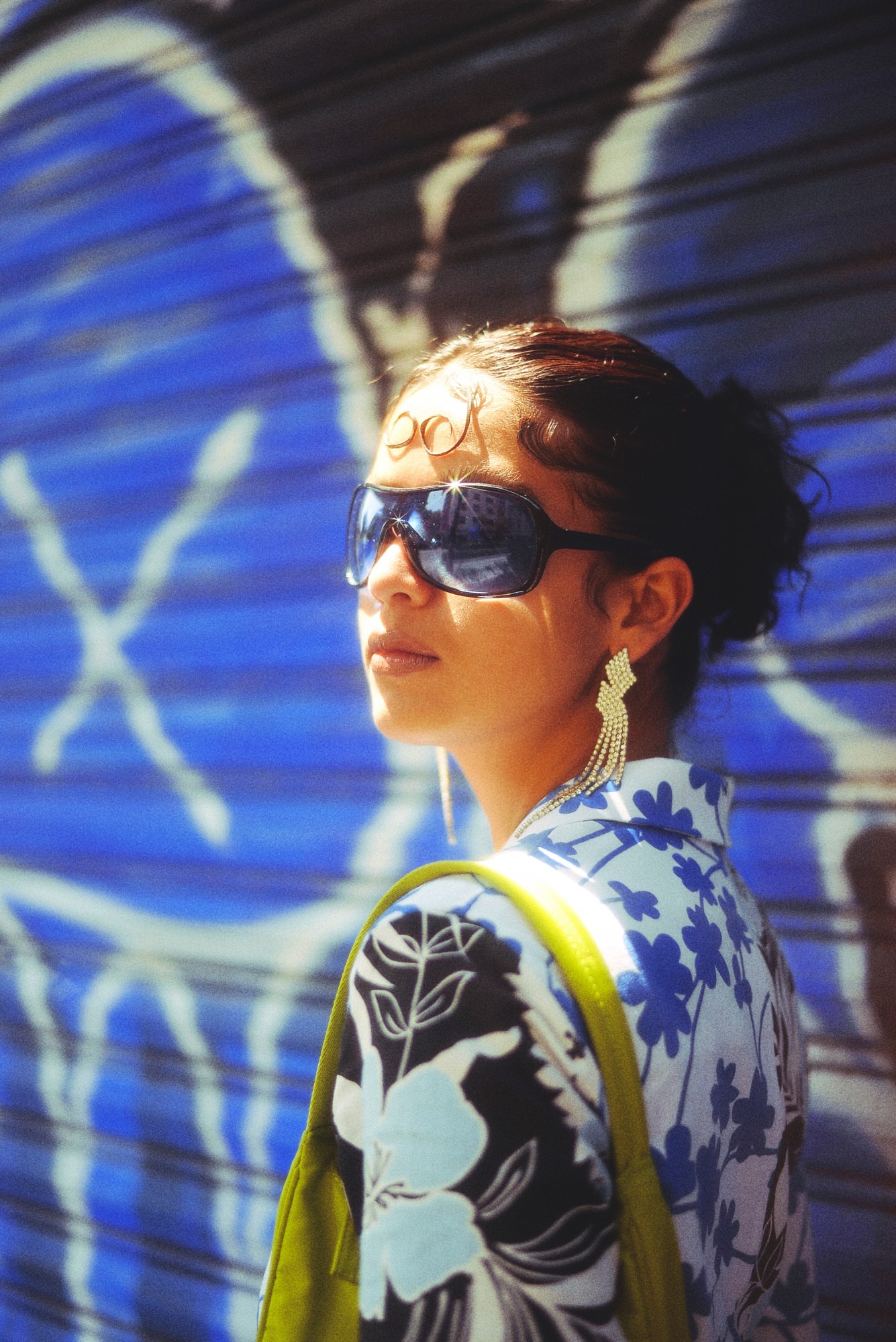 A model wearing bright colourful clothes by Katsu Clothing in the streets of Centro, Mexico City