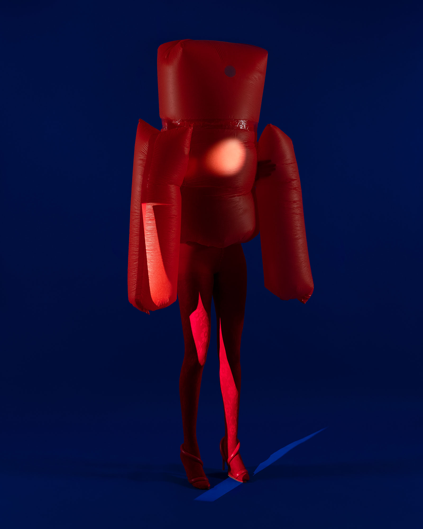 a person inside a red inflatable outfit