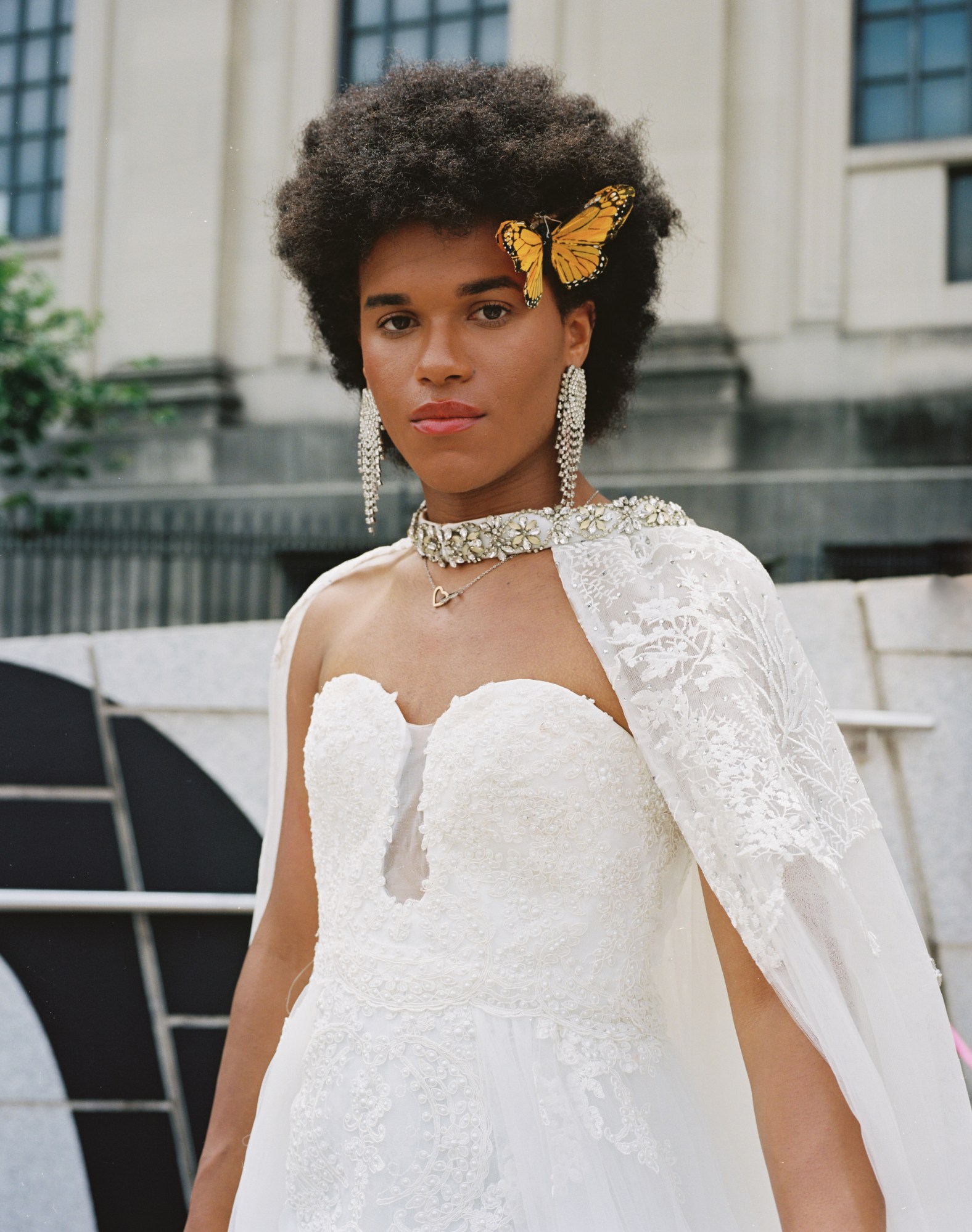 Joel Riveria in a beautiful white dress and butterfly clip.