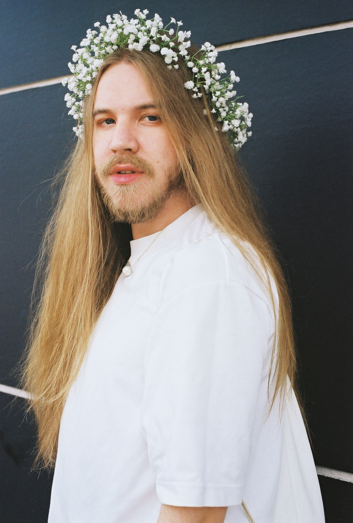 George Mott wearing a flower crown.