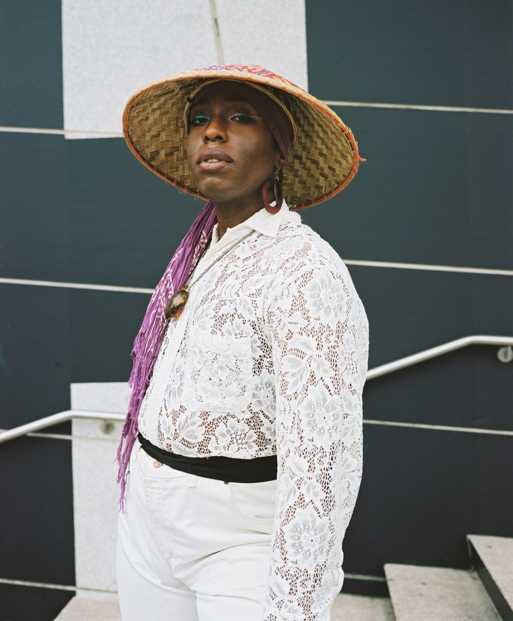 A person wearing a hat and wearing all white at the Brooklyn Liberation rally.