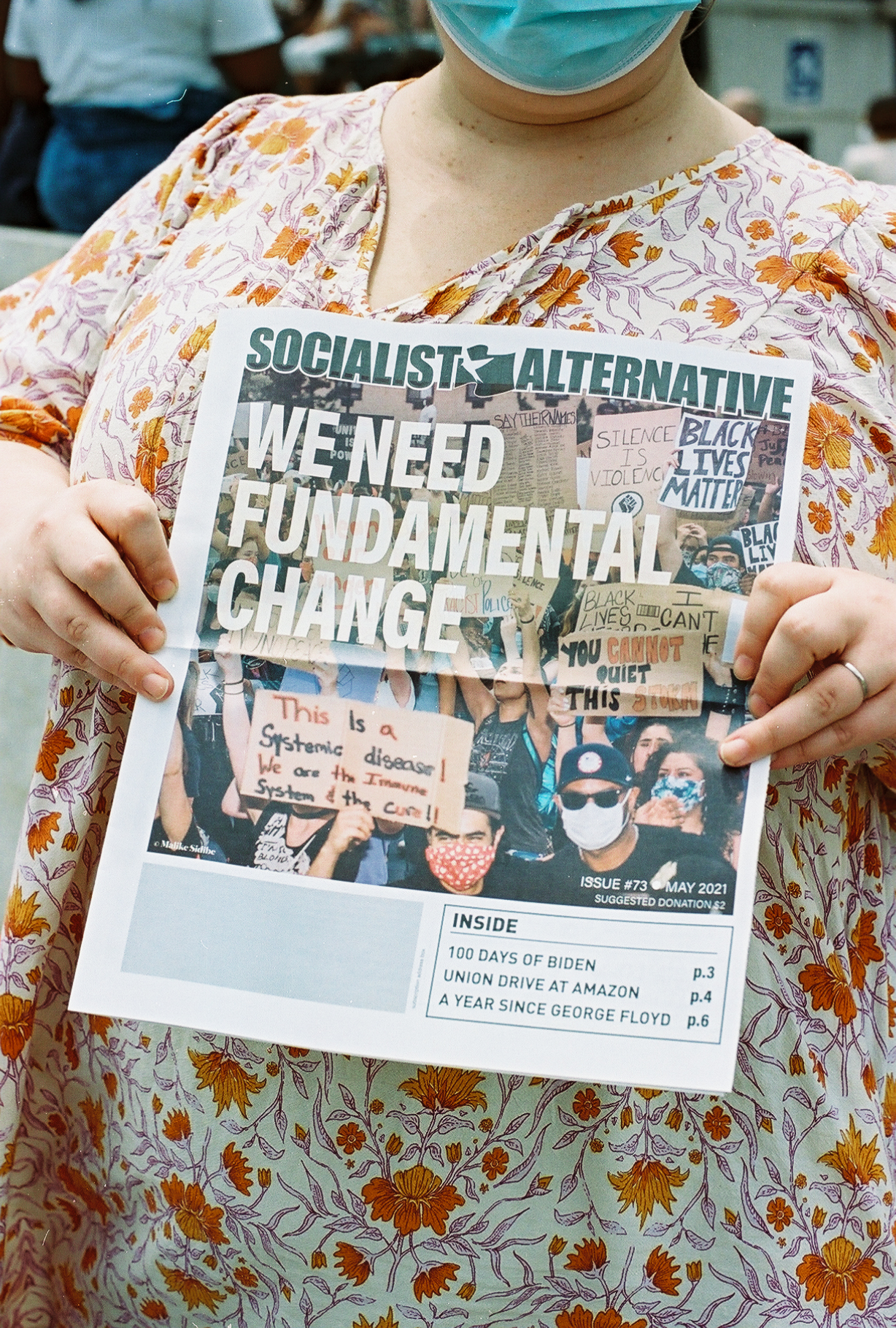 A newspaper headline reading 'we need fundamental change'.