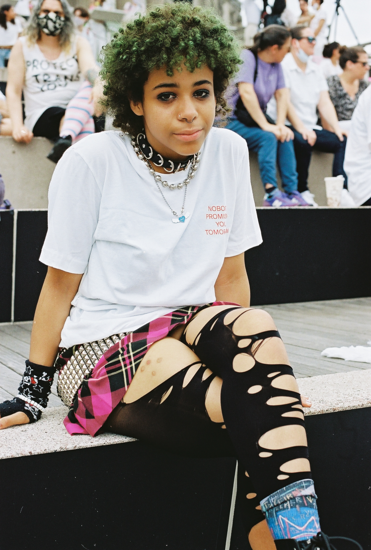 A person wearing ripped tights at the Brooklyn Liberation rally.