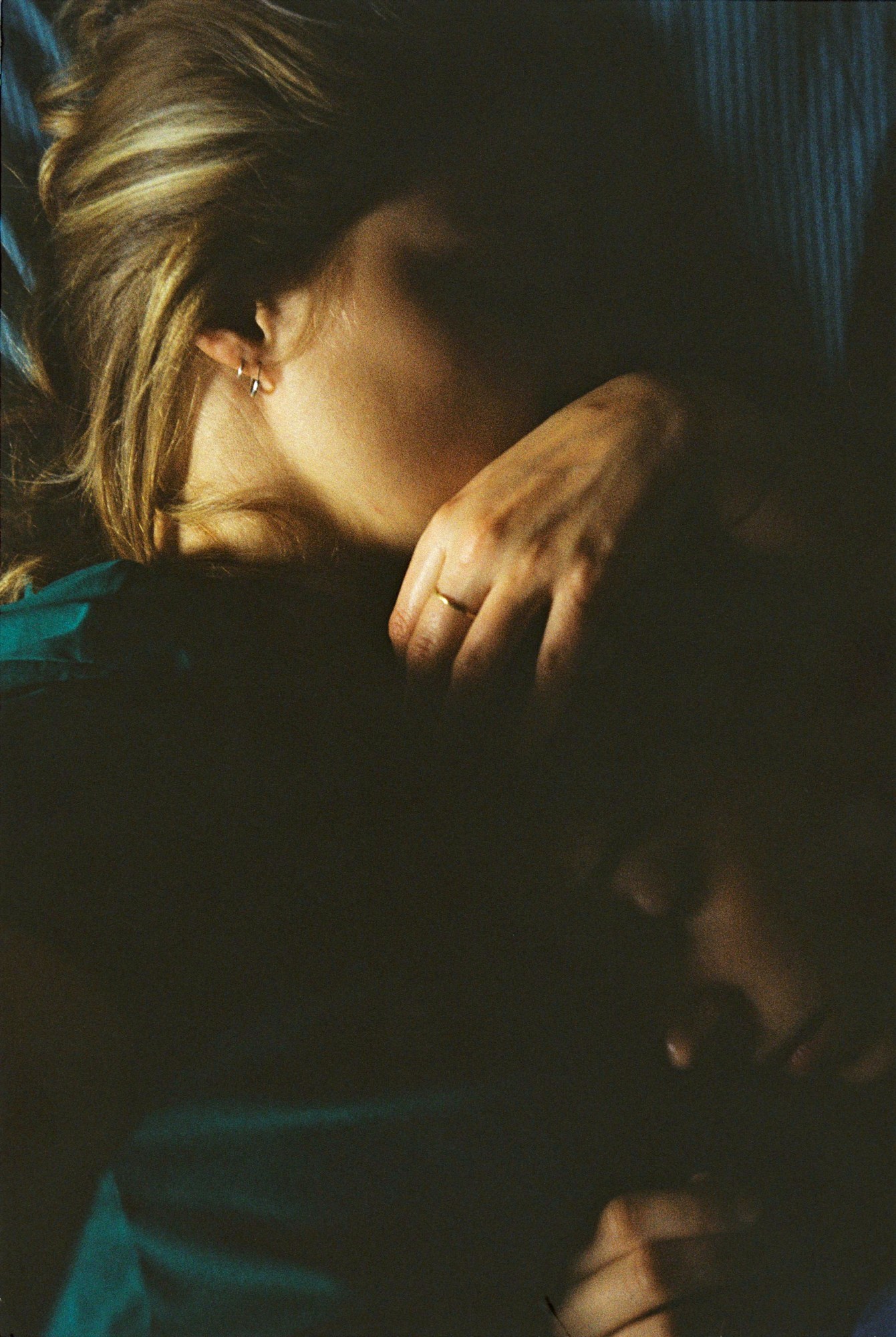 a woman holds another woman's head lying on her stomach