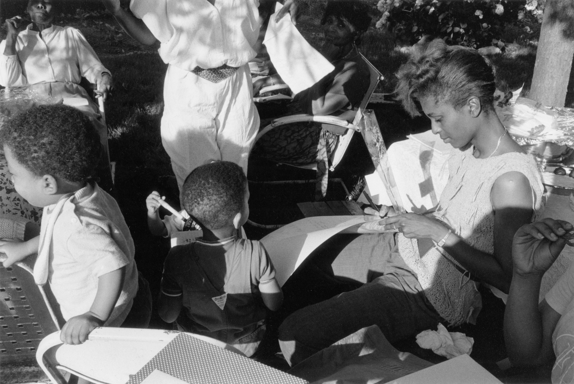 women and small children and buggies at a baby shower