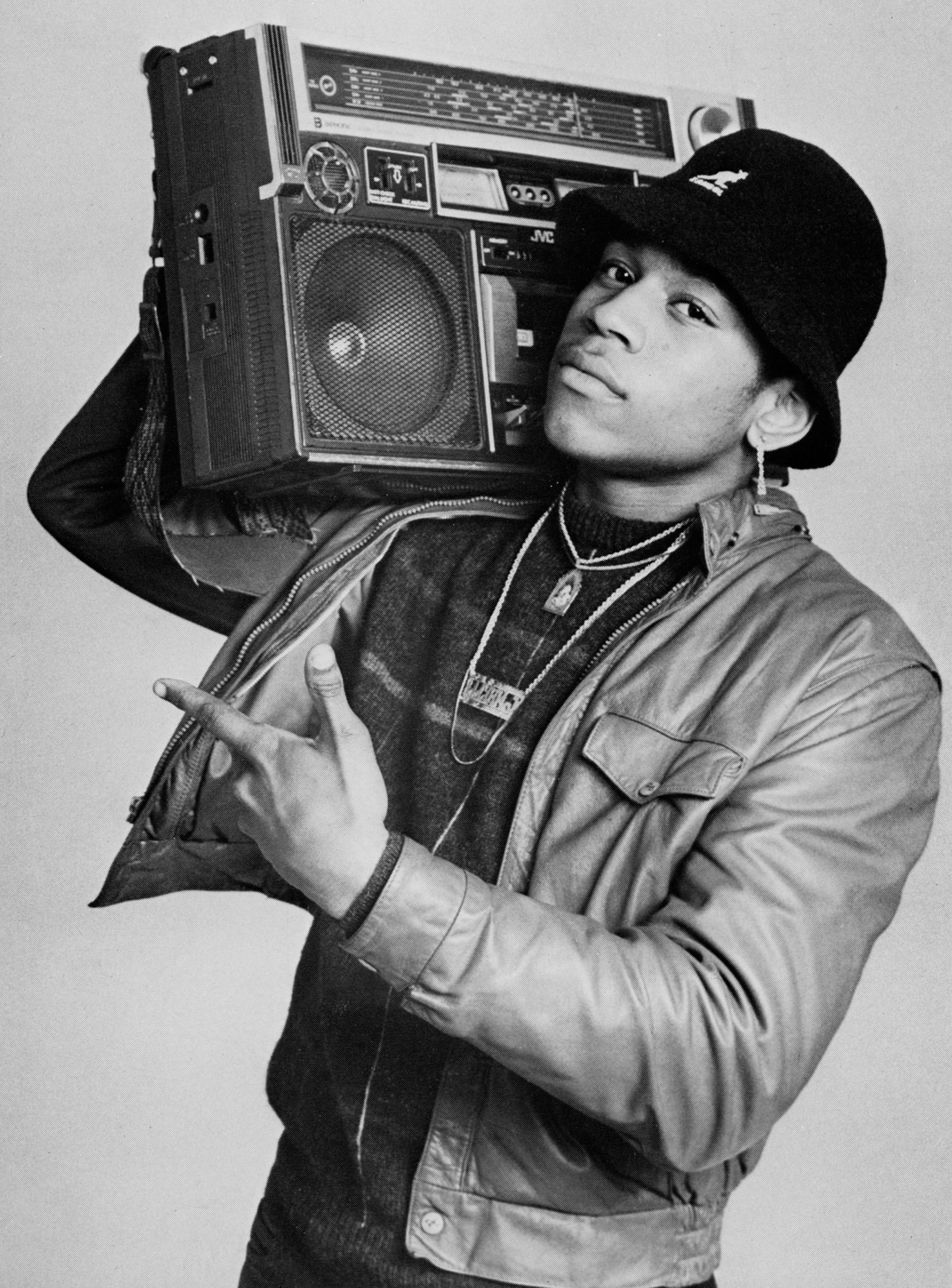 the musician ll cool j holding up a boom box