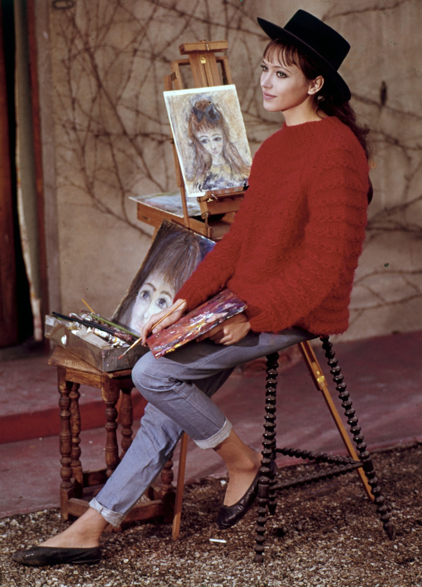 anna karina painting outside at her home in paris