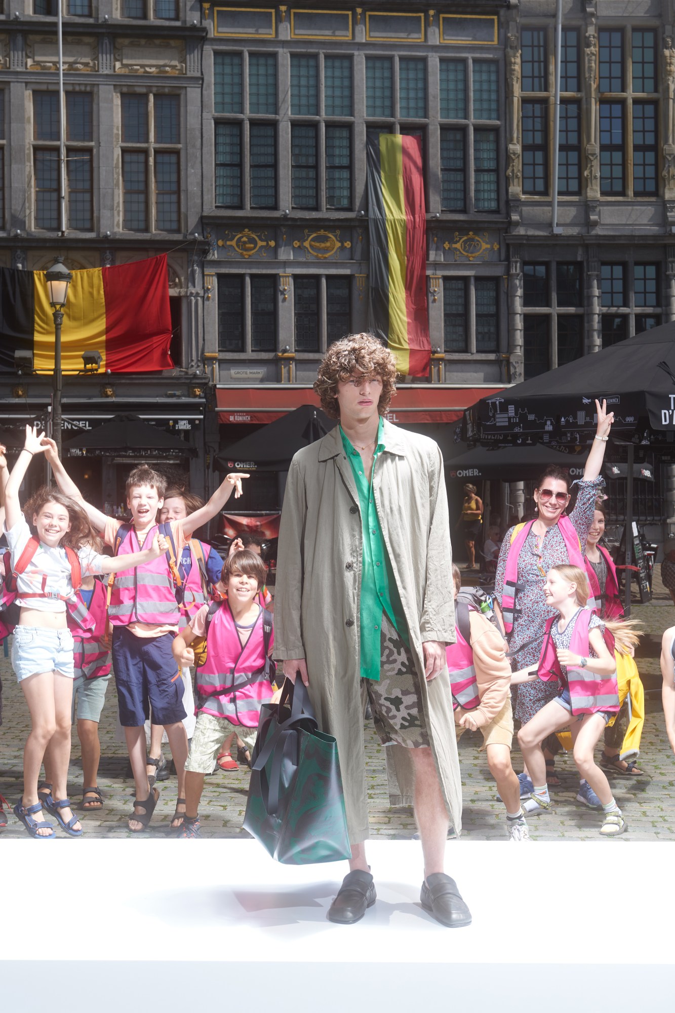 a model wearing Dries Van Noten SS22 in the middle of Antwerp