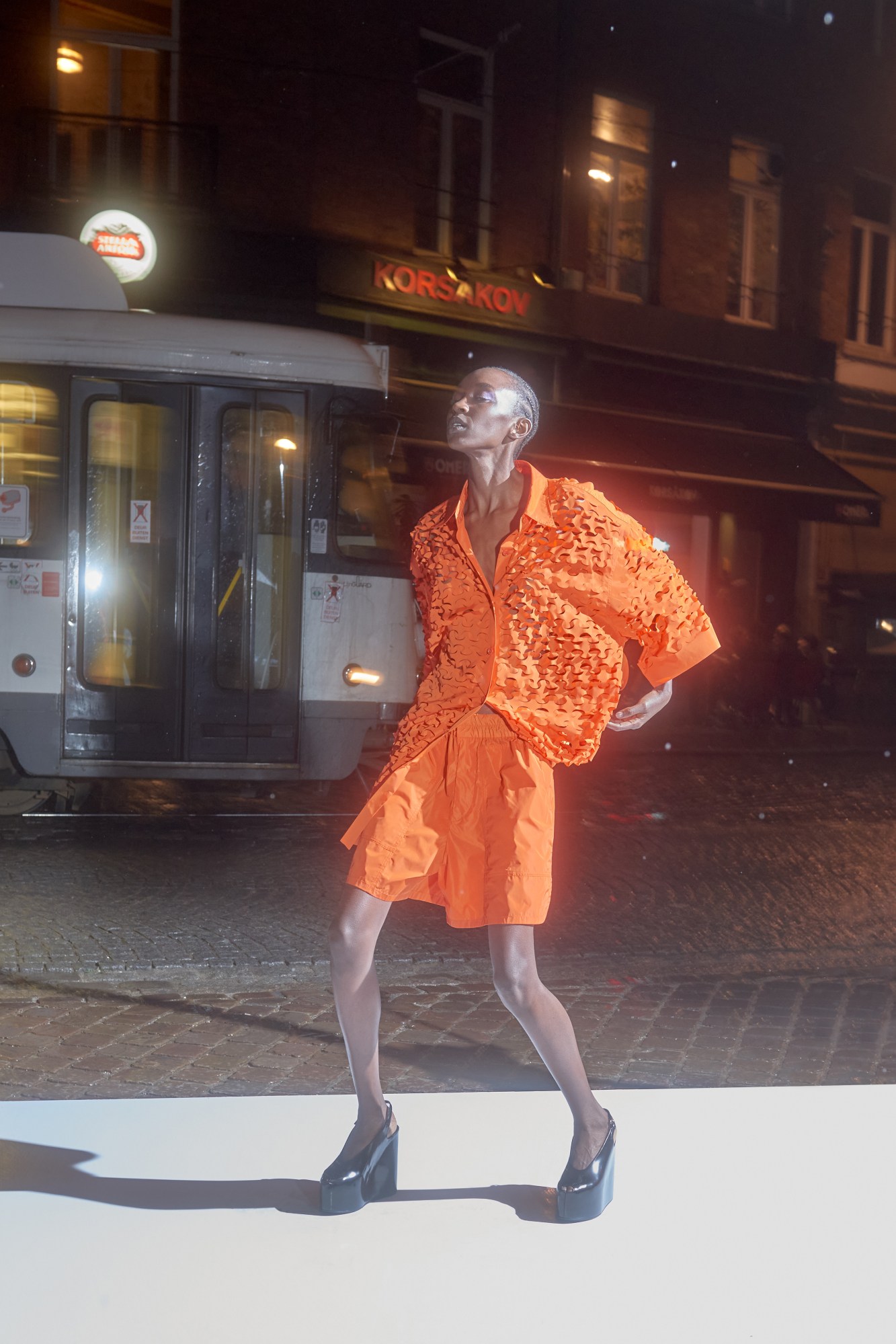 a model wearing Dries Van Noten SS22 in the middle of Antwerp