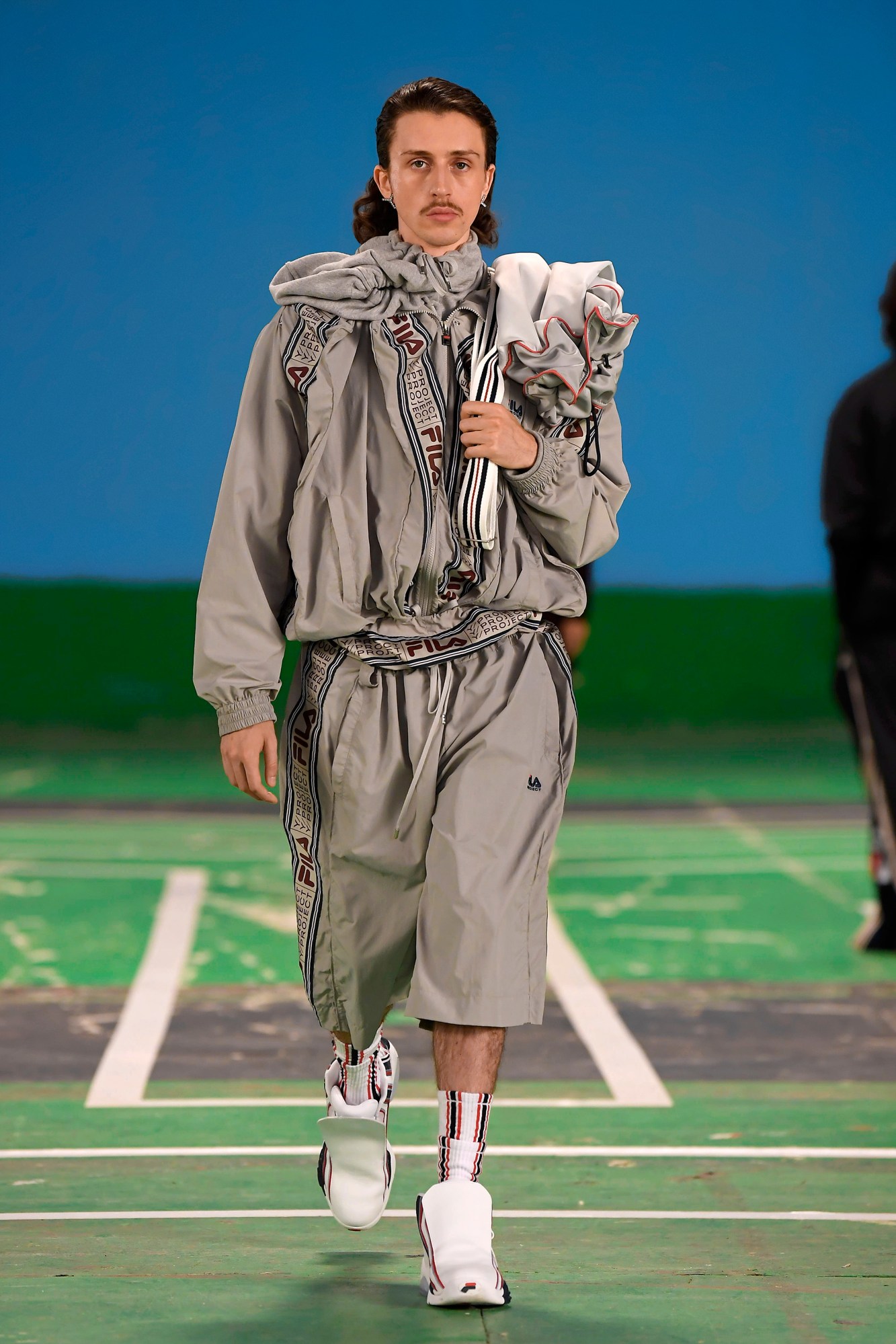 A model wearing a full look from Y/Project's SS22 collection