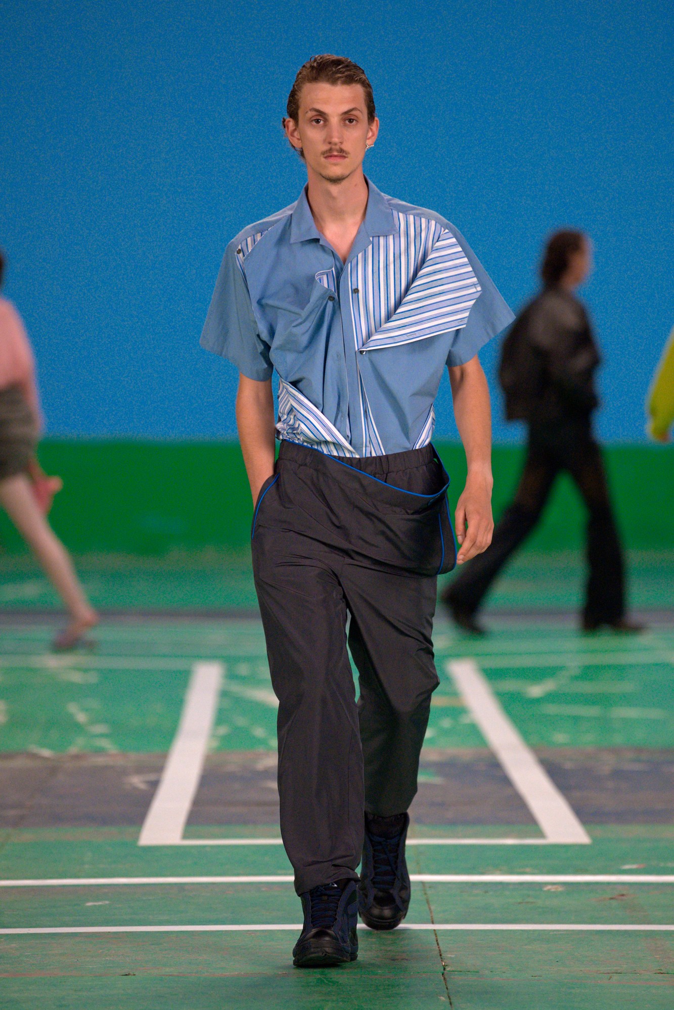 A model wearing a full look from Y/Project's SS22 collection