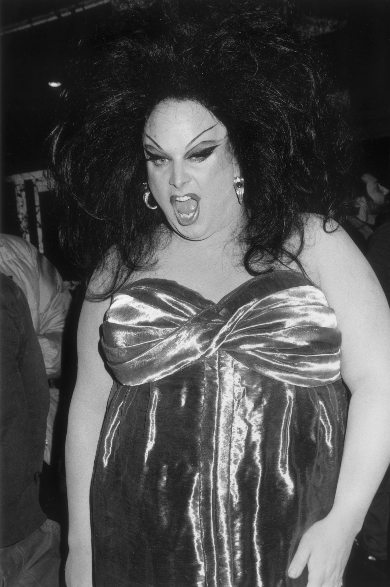 Drag queen actor Divine (1945-1988, born Harris Glenn Milstead) poses for paparazzi at the premiere of director John Waters' film, 'Female Trouble,' in which Divine starred, New York City.