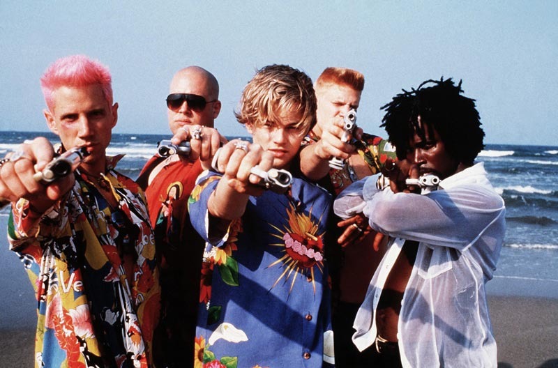 characters in baz luhrmann's romeo and juliet pointing guns at the camera