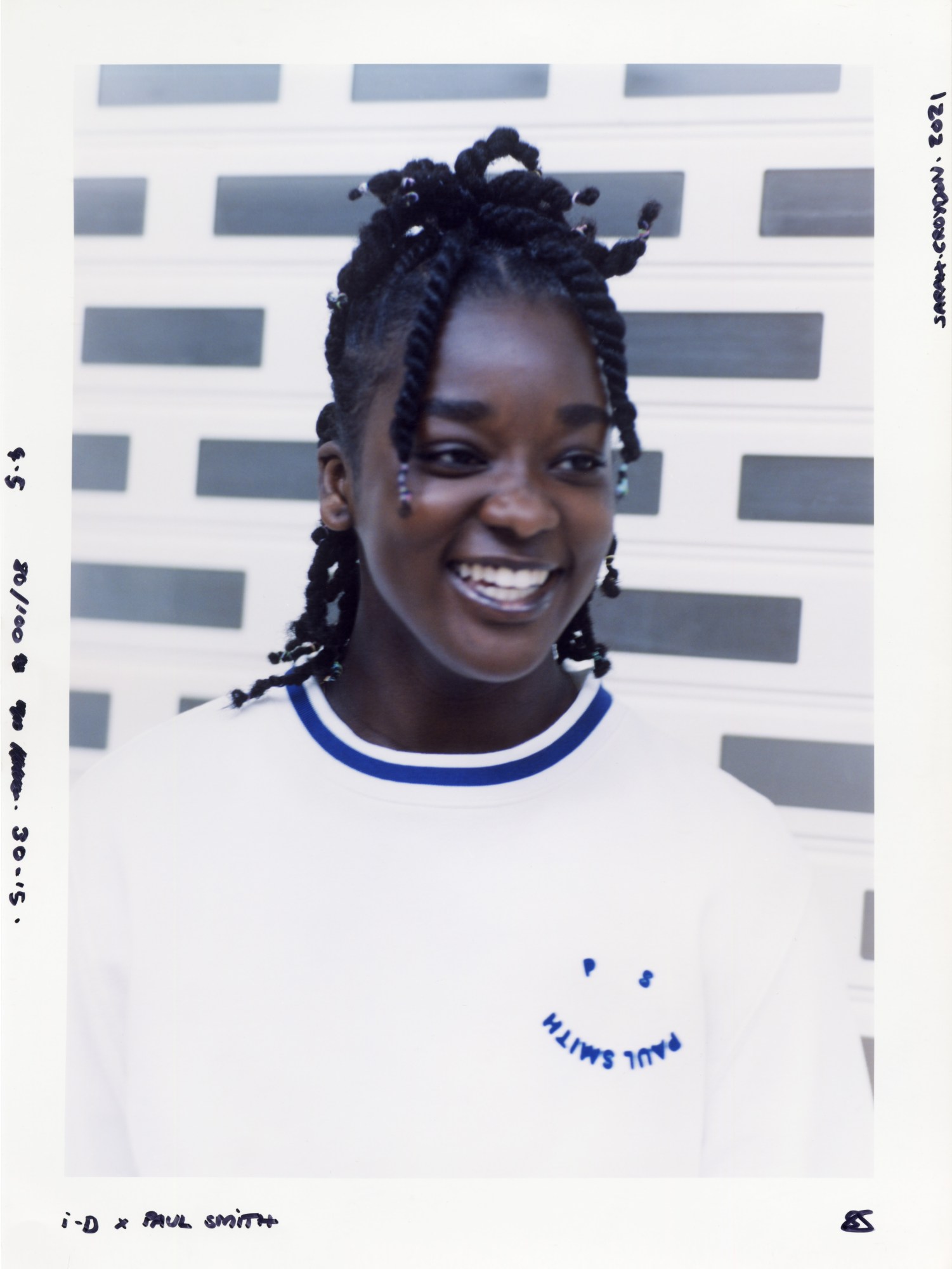 a young woman wearing ps by paul smith laughs