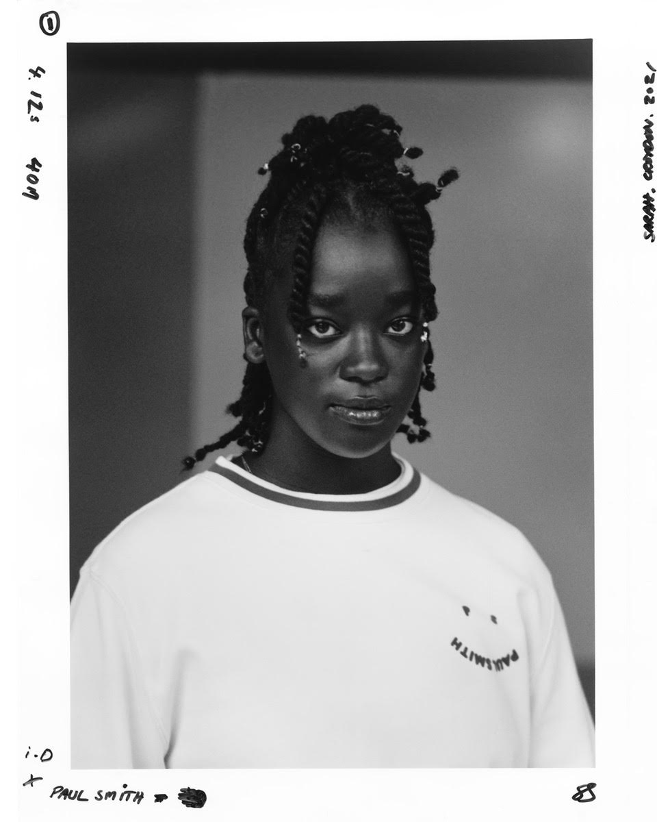 a young woman wearing ps paul smith