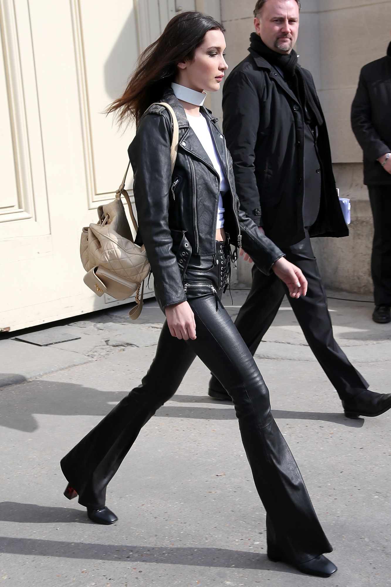 bella hadid wearing leather pants and walking in paris