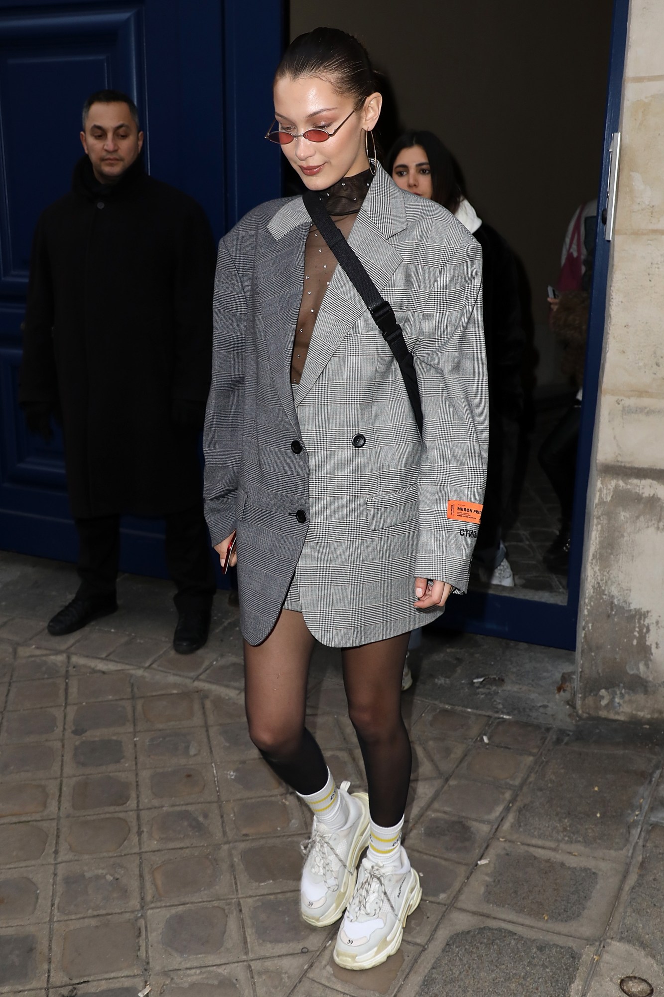 bella hadid leaving a fashion show in heron preston in paris