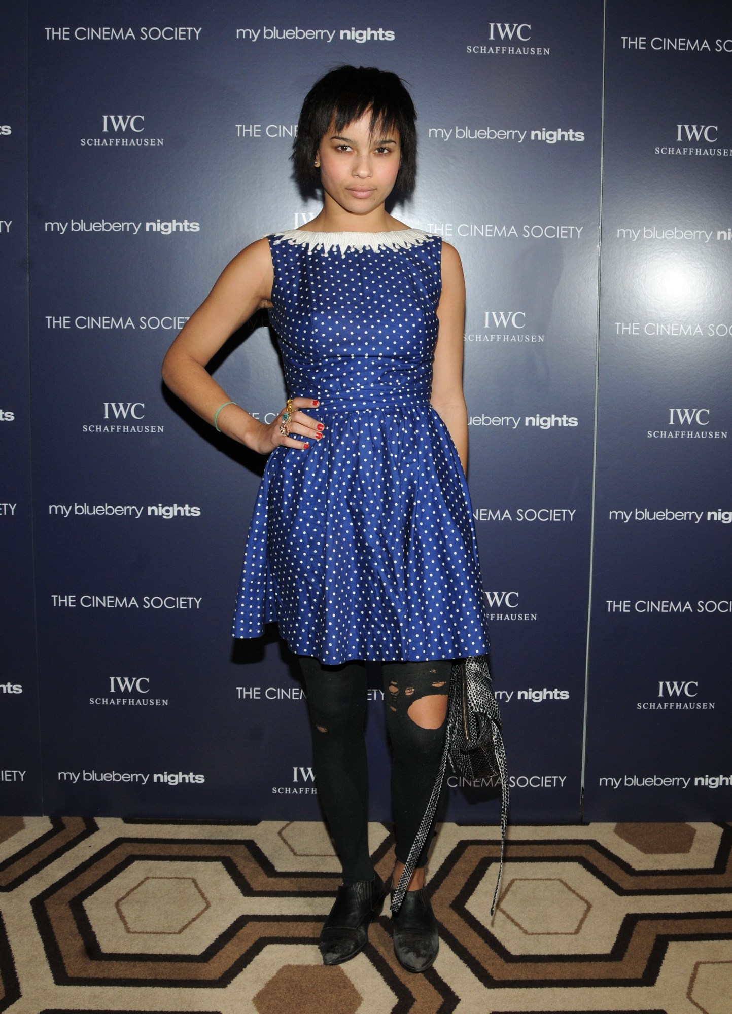 zoe kravitz posing with her hand on her hip at a movie premiere 2008