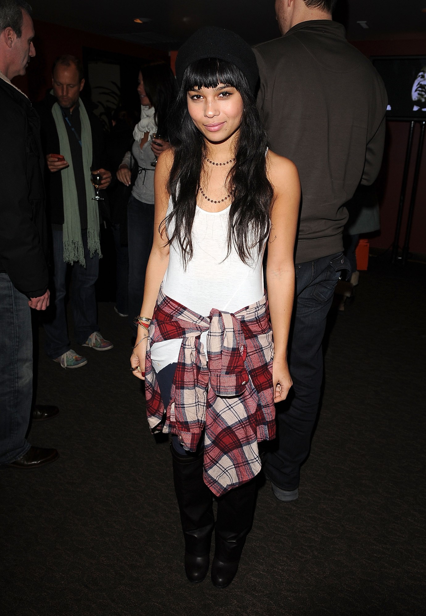 zoe kravitz in a white tank and plaid shirt at a party in 2009